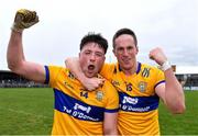 9 April 2023; Clare players Keelan Sexton, left, and Eoin Cleary celebrate after their side's victory in the Munster GAA Football Senior Championship Quarter-Final match between Clare and Cork at Cusack Park in Ennis, Clare. Photo by Piaras Ó Mídheach/Sportsfile