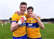 9 April 2023; Clare players Darren O'Neill, left, and Mark McInerney celebrates after their side's victory in the Munster GAA Football Senior Championship Quarter-Final match between Clare and Cork at Cusack Park in Ennis, Clare. Photo by Piaras Ó Mídheach/Sportsfile