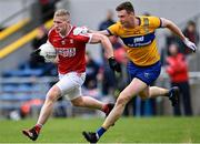 9 April 2023; Ruairí Deane of Cork in action against Darren O'Neill of Clare during the Munster GAA Football Senior Championship Quarter-Final match between Clare and Cork at Cusack Park in Ennis, Clare. Photo by Piaras Ó Mídheach/Sportsfile
