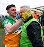 9 April 2023; Offaly manager Martin Murphy and Ruairi McNamee celebrate at the final whistle after the Leinster GAA Football Senior Championship Round 1 match between Longford and Offaly at Glennon Brothers Pearse Park in Longford. Photo by Ray McManus/Sportsfile