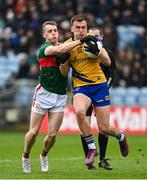 9 April 2023; Enda Smith of Roscommon in action against Eoghan McLaughlin of Mayo during the Connacht GAA Football Senior Championship Quarter-Final match between Mayo and Roscommon at Hastings Insurance MacHale Park in Castlebar, Mayo. Photo by Ramsey Cardy/Sportsfile