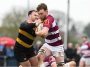 9 April 2023; Philip Byrne of Tullow RFC is tackled by Adam Strong of County Carlow FC during the Bank of Ireland Provincial Towns Cup Semi-Final match between County Carlow FC and Tullow RFC at Enniscorthy RFC in Enniscorthy, Wexford. Photo by Matt Browne/Sportsfile