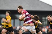 9 April 2023; Philip Byrne of Tullow RFC is tackled by Neill Slater of County Carlow FC during the Bank of Ireland Provincial Towns Cup Semi-Final match between County Carlow FC and Tullow RFC at Enniscorthy RFC in Enniscorthy, Wexford. Photo by Matt Browne/Sportsfile