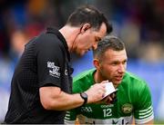 9 April 2023; Referee Sean Hurson notes the name of Anton Sullivan of Offaly before issuing him a yellow card late in the Leinster GAA Football Senior Championship Round 1 match between Longford and Offaly at Glennon Brothers Pearse Park in Longford. Photo by Ray McManus/Sportsfile