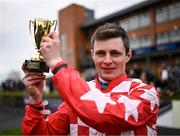 9 April 2023; Jockey Sean O'Keeffe with the cup after winning the WilllowWarm Gold Cup on day two of the Fairyhouse Easter Festival at Fairyhouse Racecourse in Ratoath, Meath. Photo by Harry Murphy/Sportsfile