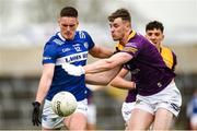 9 April 2023; Patrick O'Sullivan of Laois in action against Niall Hughes of Wexford during the Leinster GAA Football Senior Championship Round 1 match between Laois and Wexford at Laois Hire O'Moore Park in Portlaoise, Laois. Photo by Tom Beary/Sportsfile
