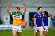 9 April 2023; Joe Maher of Offaly celebrates and Darren Gallagher of Longford shows his disapointment at the final whistle during the Leinster GAA Football Senior Championship Round 1 match between Longford and Offaly at Glennon Brothers Pearse Park in Longford. Photo by Ray McManus/Sportsfile