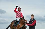 9 April 2023; Jockey Sean O'Keeffe celebrates on Flame Bearer with groom Paul Roche after winning the WilllowWarm Gold Cup on day two of the Fairyhouse Easter Festival at Fairyhouse Racecourse in Ratoath, Meath. Photo by Harry Murphy/Sportsfile