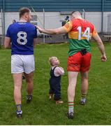 9 April 2023; Dean Healy of Wicklow, with his daughter Fia, aged 2, and Darragh Foley of Carlow after the Leinster GAA Football Senior Championship Round 1 match between Wicklow and Carlow at Echelon Park in Aughrim, Wicklow. Photo by Daire Brennan/Sportsfile