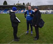 9 April 2023; Wicklow manager Oisín McConville does an interview with Michael Sargent of East Coast FM, as Michael's nephew Ryan, aged 13, holds on the notes, after the Leinster GAA Football Senior Championship Round 1 match between Wicklow and Carlow at Echelon Park in Aughrim, Wicklow. Photo by Daire Brennan/Sportsfile