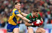 9 April 2023; Jordan Flynn of Mayo in action against Cian McKeon of Roscommon during the Connacht GAA Football Senior Championship Quarter-Final match between Mayo and Roscommon at Hastings Insurance MacHale Park in Castlebar, Mayo. Photo by Ramsey Cardy/Sportsfile