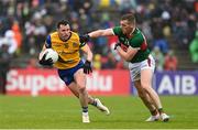 9 April 2023; Ciaráin Murtagh of Roscommon in action against Eoghan McLaughlin of Mayo during the Connacht GAA Football Senior Championship Quarter-Final match between Mayo and Roscommon at Hastings Insurance MacHale Park in Castlebar, Mayo. Photo by Ramsey Cardy/Sportsfile