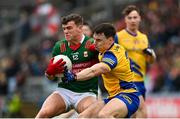 9 April 2023; Jordan Flynn of Mayo in action against Conor Hussey of Roscommon during the Connacht GAA Football Senior Championship Quarter-Final match between Mayo and Roscommon at Hastings Insurance MacHale Park in Castlebar, Mayo. Photo by Ramsey Cardy/Sportsfile