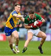 9 April 2023; Jordan Flynn of Mayo in action against Cian McKeon of Roscommon during the Connacht GAA Football Senior Championship Quarter-Final match between Mayo and Roscommon at Hastings Insurance MacHale Park in Castlebar, Mayo. Photo by Ramsey Cardy/Sportsfile