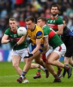 9 April 2023; Enda Smith of Roscommon in action against Jordan Flynn of Mayo during the Connacht GAA Football Senior Championship Quarter-Final match between Mayo and Roscommon at Hastings Insurance MacHale Park in Castlebar, Mayo. Photo by Ramsey Cardy/Sportsfile