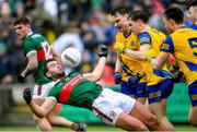 9 April 2023; Aidan O'Shea of Mayo in falls back against Conor Hussey and David Murray of Roscommon during the Connacht GAA Football Senior Championship Quarter-Final match between Mayo and Roscommon at Hastings Insurance MacHale Park in Castlebar, Mayo. Photo by Ray Ryan/Sportsfile