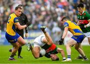 9 April 2023; Jordan Flynn of Mayo, tumbles, while in action against Enda Smith of Roscommon during the Connacht GAA Football Senior Championship Quarter-Final match between Mayo and Roscommon at Hastings Insurance MacHale Park in Castlebar, Mayo. Photo by Ray Ryan/Sportsfile