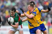9 April 2023; Diarmuid O'Connor of Mayo in action against Eoin McCormack and Ciarán Lennon of Roscommon during the Connacht GAA Football Senior Championship Quarter-Final match between Mayo and Roscommon at Hastings Insurance MacHale Park in Castlebar, Mayo. Photo by Ray Ryan/Sportsfile