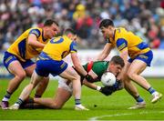 9 April 2023; Jordan Flynn of Mayo in action against Roscommon players, from left, Enda Smith, Ciaráin Murtagh and Conor Hussey during the Connacht GAA Football Senior Championship Quarter-Final match between Mayo and Roscommon at Hastings Insurance MacHale Park in Castlebar, Mayo. Photo by Ray Ryan/Sportsfile