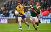 9 April 2023; Keith Doyle of Roscommon in action against Diarmuid O’Connor of Mayo during the Connacht GAA Football Senior Championship Quarter-Final match between Mayo and Roscommon at Hastings Insurance MacHale Park in Castlebar, Mayo. Photo by Ramsey Cardy/Sportsfile
