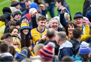 9 April 2023; Dylan Ruane of Roscommon stands with supporters for a photograph after the Connacht GAA Football Senior Championship Quarter-Final match between Mayo and Roscommon at Hastings Insurance MacHale Park in Castlebar, Mayo. Photo by Ray Ryan/Sportsfile