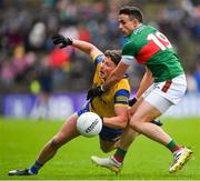 9 April 2023; Conor Cox of Roscommon in action against Jason Doherty of Mayo during the Connacht GAA Football Senior Championship Quarter-Final match between Mayo and Roscommon at Hastings Insurance MacHale Park in Castlebar, Mayo. Photo by Ray Ryan/Sportsfile