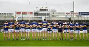 9 April 2023; The Tipperary squad pause for a minutes silence in memory of the late Noel Cosgrave a referee from the Marlfield club in Tipperary before the Munster GAA Football Senior Championship Quarter-Final match between Tipperary and Waterford at FBD Semple Stadium in Thurles, Tipperary. Photo by Stephen Marken/Sportsfile