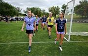9 April 2023; Team captains Hannah Tyrrell of Dublin and 2021 Allstars, left, and Aimee Mackin of Armagh and 2022 Allstars lead their teams out before the TG4 LGFA All-Star exhibition match between the 2021 Allstars and the 2022 Allstars at St Edward's University in Austin, Texas, USA. Photo by Brendan Moran/Sportsfile