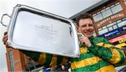 10 April 2023; Jockey Paul Townend celebrates with the trophy after winning the BoyleSports Irish Grand National Steeplechase on I Am Maximus during day three of the Fairyhouse Easter Festival at Fairyhouse Racecourse in Ratoath, Meath. Photo by Seb Daly/Sportsfile