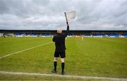 9 April 2023; A linesman hold his flag aloft as a substitution is made during the Leinster GAA Football Senior Championship Round 1 match between Longford and Offaly at Glennon Brothers Pearse Park in Longford. Photo by Ray McManus/Sportsfile