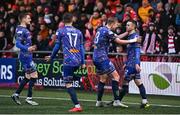 10 April 2023; Dean Williams of Bohemians, right, celebrates with teammates after scoring their side's first goal, from a penalty, during the SSE Airtricity Men's Premier Division match between Derry City and Bohemians at The Ryan McBride Brandywell Stadium in Derry. Photo by Ramsey Cardy/Sportsfile