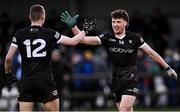 12 April 2023; Sligo players Daire O'Boyle and Ross Doherty, 12, celebrate after their side's victory in the Eirgrid Connacht GAA Football U20 Championship Semi-Final match between Sligo and Mayo at Connacht GAA COE in Bekan, Mayo. Photo by Piaras Ó Mídheach/Sportsfile