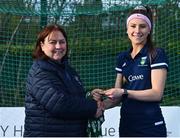 13 April 2023; Leah O'Shea is presented with her winners medal by Vice President of Hockey Ireland Barbara O'Malley during the UCD Ladies Hockey EYHL medal presentation event at UCD Hockey Stadium in Belfield, Dublin. Photo by Tyler Miller/Sportsfile