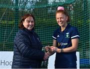 13 April 2023; Sarah McAuley is presented with her winners medal by Vice President of Hockey Ireland Barbara O'Malley during the UCD Ladies Hockey EYHL medal presentation event at UCD Hockey Stadium in Belfield, Dublin. Photo by Tyler Miller/Sportsfile