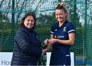 13 April 2023; Ali Griffin is presented with her winners medal by Vice President of Hockey Ireland Barbara O'Malley during the UCD Ladies Hockey EYHL medal presentation event at UCD Hockey Stadium in Belfield, Dublin. Photo by Tyler Miller/Sportsfile