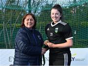 13 April 2023; Lisa McLoughlin is presented with her winners medal by Vice President of Hockey Ireland Barbara O'Malley during the UCD Ladies Hockey EYHL medal presentation event at UCD Hockey Stadium in Belfield, Dublin. Photo by Tyler Miller/Sportsfile