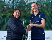 13 April 2023; Katie Jane Marshall is presented with her winners medal by Vice President of Hockey Ireland Barbara O'Malley during the UCD Ladies Hockey EYHL medal presentation event at UCD Hockey Stadium in Belfield, Dublin. Photo by Tyler Miller/Sportsfile