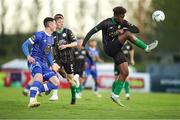 14 April 2023; Samuel Aladesanusi of Kerry FC in action against Ronan Coughlan of Waterford during the SSE Airtricity Men's First Division match between Waterford and Kerry at the RSC in Waterford. Photo by Michael P Ryan/Sportsfile