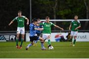 14 April 2023; Joseph O’Brien-Whitmarsh of Cork City in action against Brendan Barr of UCD during the SSE Airtricity Men's Premier Division match between UCD and Cork City at UCD Bowl in Dublin. Photo by Stephen Marken/Sportsfile