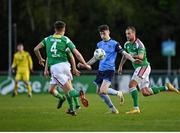 14 April 2023; Jake Doyle of UCD in action against Cian Coleman and Ally Gilchrist of Cork City during the SSE Airtricity Men's Premier Division match between UCD and Cork City at UCD Bowl in Dublin. Photo by Stephen Marken/Sportsfile