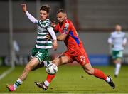 14 April 2023; Johnny Kenny of Shamrock Rovers in action against Paddy Barrett of Shelbourne during the SSE Airtricity Men's Premier Division match between Shamrock Rovers and Shelbourne at Tallaght Stadium in Dublin. Photo by Seb Daly/Sportsfile