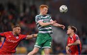 14 April 2023; Rory Gaffney of Shamrock Rovers in action against Paddy Barrett, left, and Andrew Quinn of Shelbourne during the SSE Airtricity Men's Premier Division match between Shamrock Rovers and Shelbourne at Tallaght Stadium in Dublin. Photo by Seb Daly/Sportsfile