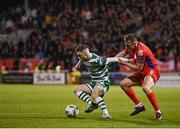 14 April 2023; Jack Byrne of Shamrock Rovers in action against Paddy Barrett of Shelbourne during the SSE Airtricity Men's Premier Division match between Shamrock Rovers and Shelbourne at Tallaght Stadium in Dublin. Photo by Seb Daly/Sportsfile