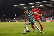 14 April 2023; Gary O'Neill of Shamrock Rovers in action against Evan Caffrey of Shelbourne during the SSE Airtricity Men's Premier Division match between Shamrock Rovers and Shelbourne at Tallaght Stadium in Dublin. Photo by Seb Daly/Sportsfile