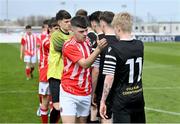 15 April 2023; St Joseph’s captain Scott Higgins shakes hands with Rian O’Riordan of College Corinthians before the FAI Youth Cup Final match between St Joseph’s AFC, Dublin, and College Corinthians AFC, Cork, at the Carlisle Grounds in Bray, Wicklow. Photo by Seb Daly/Sportsfile