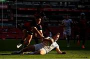 15 April 2023; Liam Turner of Leinster dives over to score his side's second try despite the tackle of Quan Horn of Emirates Lionsduring the United Rugby Championship match between Emirates Lions and Leinster at Emirates Airlines Park in Johannesburg, South Africa. Photo by Harry Murphy/Sportsfile