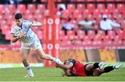 15 April 2023; Chris Cosgrave of Leinster evades the tackle of Manuel Rass of Emirates Lions during the United Rugby Championship match between Emirates Lions and Leinster at Emirates Airlines Park in Johannesburg, South Africa. Photo by Harry Murphy/Sportsfile