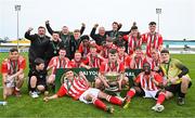 15 April 2023; St Joseph’s players and management celebrate with the trophy after their side's victory in the FAI Youth Cup Final match between St Joseph’s AFC, Dublin, and College Corinthians AFC, Cork, at the Carlisle Grounds in Bray, Wicklow. Photo by Seb Daly/Sportsfile