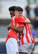 15 April 2023; Callum Byrne, left, and Emmanual Ogunsaikon of St Joseph’s celebrate after their side's victory in the FAI Youth Cup Final match between St Joseph’s AFC, Dublin, and College Corinthians AFC, Cork, at the Carlisle Grounds in Bray, Wicklow. Photo by Seb Daly/Sportsfile