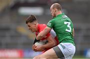 15 April 2023; Shane McGuigan of Derry in action against Shea Cullen of Fermanagh during the Ulster GAA Football Senior Championship Quarter-Final match between Fermanagh and Derry at Brewster Park in Enniskillen, Fermanagh. Photo by Ramsey Cardy/Sportsfile